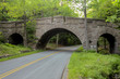 Elegant historic carriage road bridge with three arches in Acadia National Park, Maine, USA