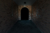 Fototapeta Do przedpokoju - Red ancient archway brick isolated on black background