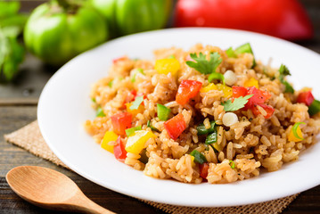 Canvas Print - Fried rice with vegetables on white dish, Asian food