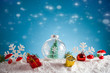 Christmas card. Christmas balls on snow and bokeh background