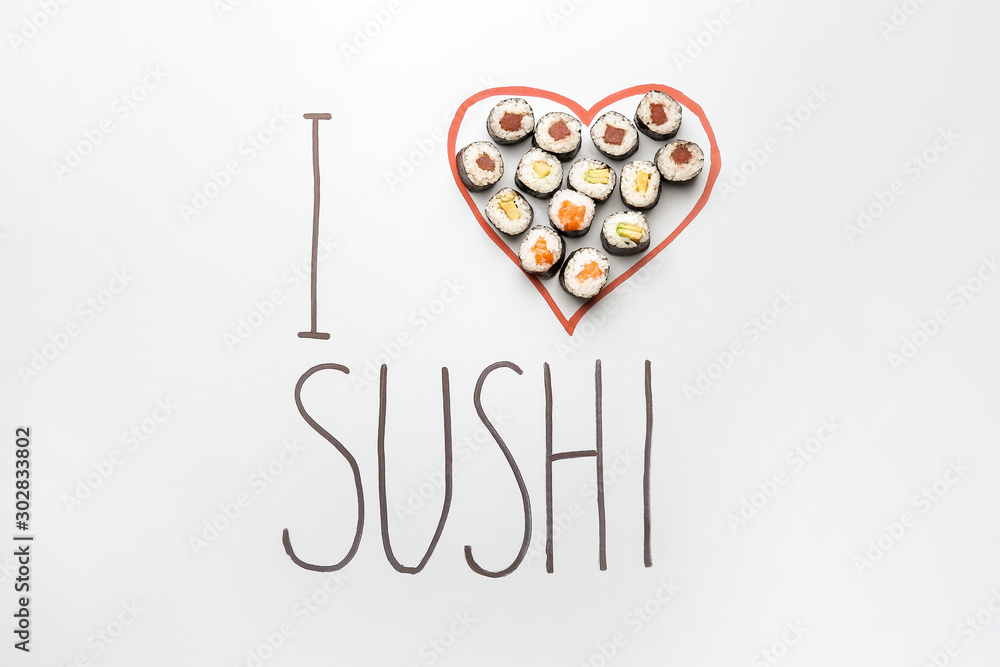Composition with text I LOVE SUSHI on light background