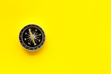 Wall Mural - Compass - small and stylish - on yellow background top view copy space
