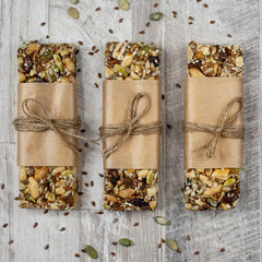 Superfood breakfast bars, healthy granola bars with nuts, seeds and dried fruits. Vertical view, top view, flat lay