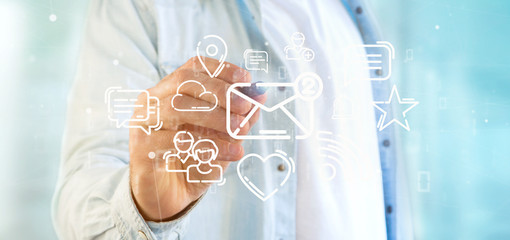 Businessman holding a cloud of social media network icon