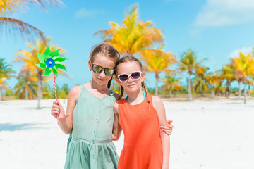 Portrait of two beautiful kids looking at camera background of beautiful nature of blue sky and turquoise sea