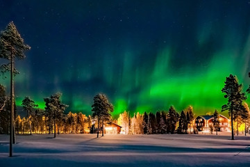 Aurora borealis (also known like northern or polar lights) beyond the Arctic Circle in winter Lapland.