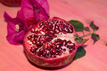 Wall Mural - pomegranate fruit on pink background
