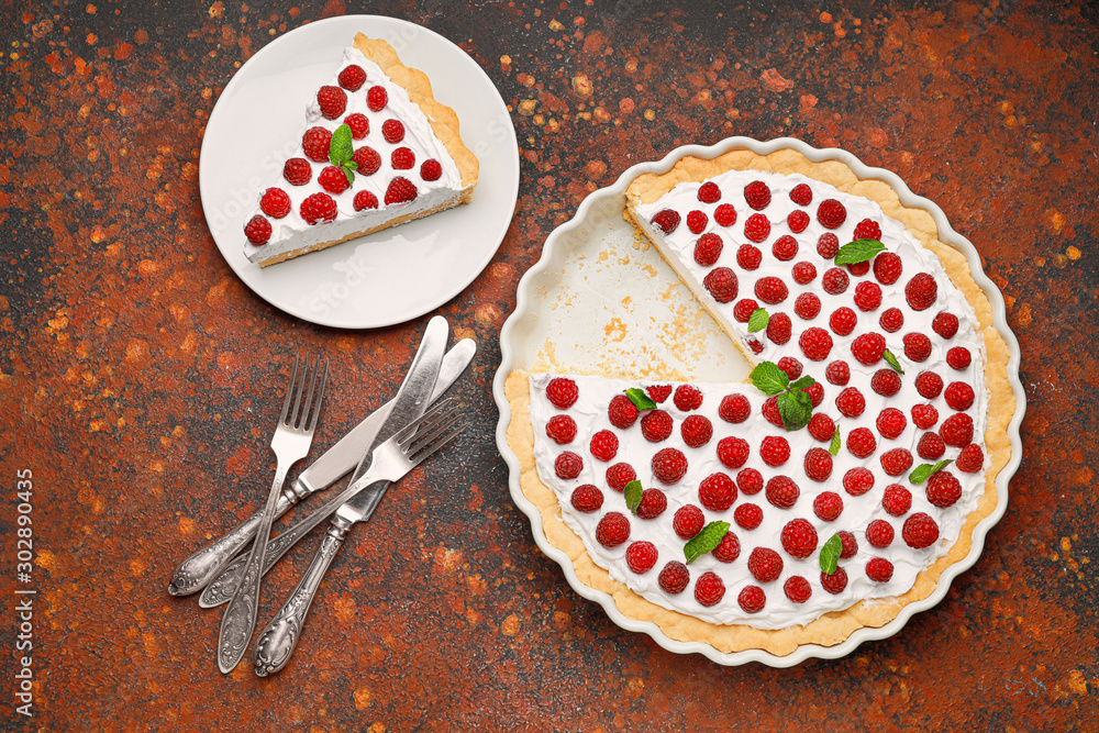 Tasty raspberry pie on table