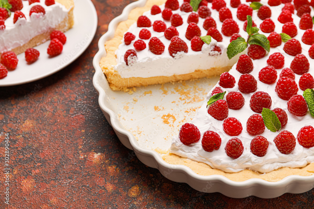 Tasty raspberry pie on table
