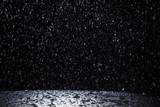 Fototapeta  - Dark background shot of rain falling