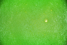 A Group Of Blurred Green Bubbles
