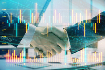 Multi exposure of financial graph on office background with two businessmen handshake. Concept of success in business