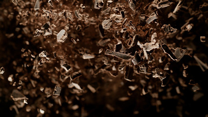 Canvas Print - Freeze motion of flying group of raw chocolate pieces.