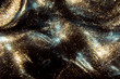 Abstract black and gold festive glitter shimmering water luxury background. de-focused