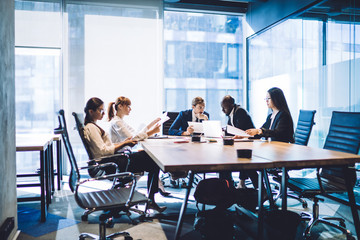 Wall Mural - Communicating business people in conference room