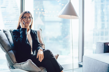 Elegant ethnic businesswoman speaking on phone