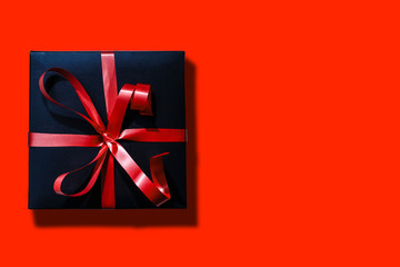 Wall Mural - Online shopping of China, 1singles day sale concept. Top view of christmas boxes with red ribbon on red background with copy space