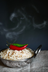 Wall Mural - Red and green chili on top of jeera rice