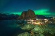 © jon_chica - northern lights at norwegian lofoten town