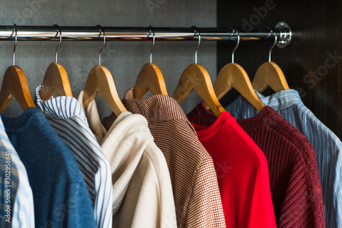Cuadros en Lienzo Different Clothes On Hangers. Shopping concept.