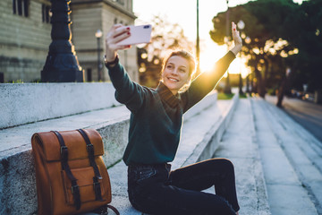Wall Mural - Happy female blogger talking about giveaway gift to fan following channel while recording vlog video during summer trip, online influencer doing live streaming viral on social media concept