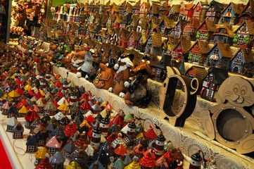 Wall Mural - Christmas Ornaments in a Christmas Market. colored lined little houses in a market, Italy. editorial image.