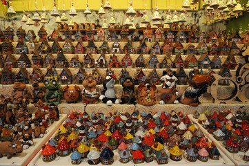 Wall Mural - Christmas Ornaments in a Christmas Market. colored lined little houses in a market, Italy. editorial image.