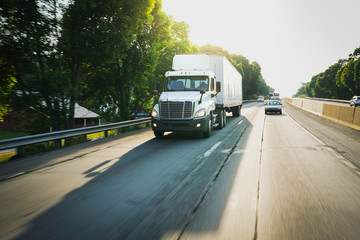 White 18 wheeler semi-truck on the road