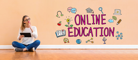 Wall Mural - Online education with young woman holding a tablet computer