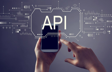 api concept with person holding a white smartphone