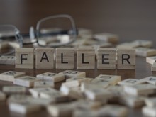 Faller The Word Or Concept Represented By Wooden Letter Tiles