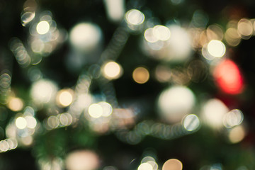 Leinwandbilder - Abstract color blur decoration ball and light string on christmas tree with bokeh light background.winter holiday seasonal
