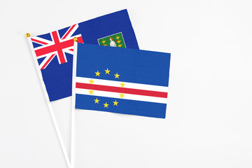 Cape Verde and British Virgin Islands stick flags on white background. High quality fabric, miniature national flag. Peaceful global concept.White floor for copy space.