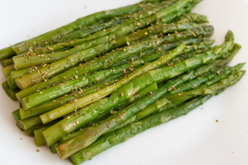 Wall Mural - asparagus with spices on a white background