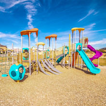 Square Frame Kids Playground With Colorful Blue Slides During Day