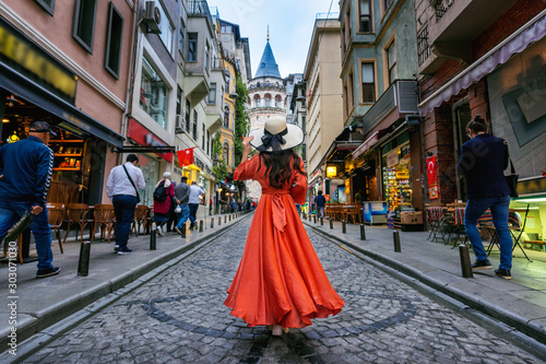 Woman standing at Galata tower in Istanbul, Turkey. Canvas Print