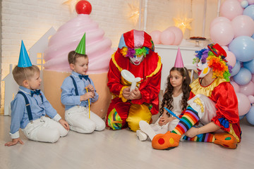 Wall Mural - Clowns from the circus on the birthday of a child. Party for children.