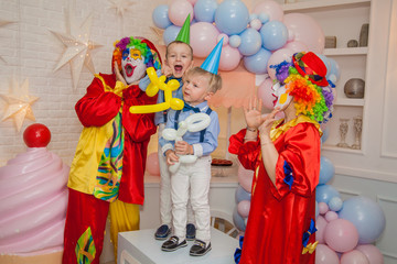 Wall Mural - Circus clowns at the birthday party. Boys and clowns. Party for children.