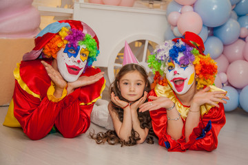 Wall Mural - Clowns from the circus on the girls birthday. Party for children.