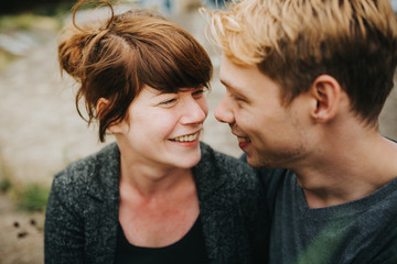 young heterosexual couple in love looking at each other