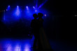 © Yuliia - The first wedding dance of the newlyweds..Silhouettes of loving couple in the dark