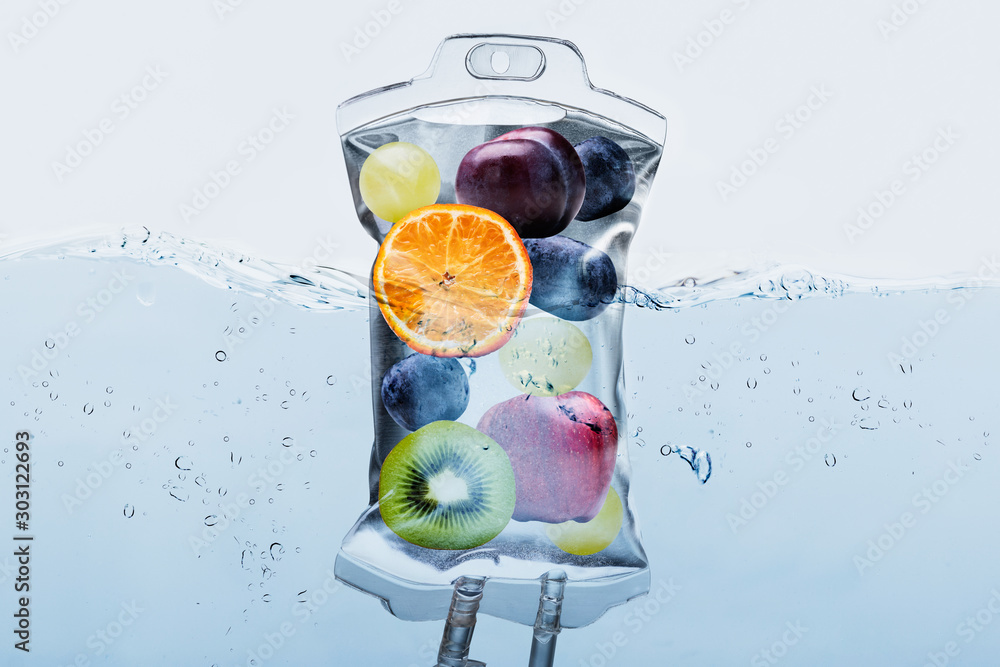Fruit Slices In Saline Bag Dipped In Water Against Background - obrazy, fototapety, plakaty 