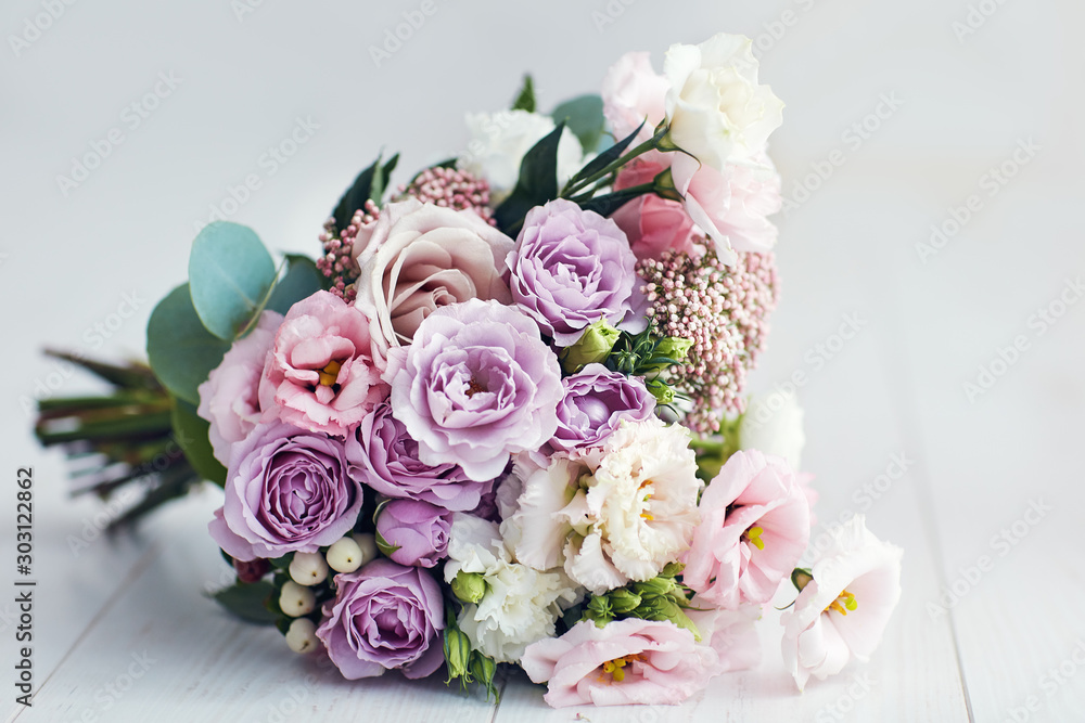 beautiful delicate flower bouquet with roses, ranunculuses, eustomas and carnations - obrazy, fototapety, plakaty 