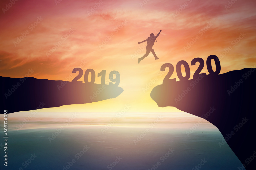 Jump to 2020 new year concept, silhouette of man jumping over  barrier cliff and success - obrazy, fototapety, plakaty 