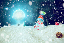 Cute Snowman In The Snow Over Blue Wooden Background. The Elements Of This Image Furnished By NASA