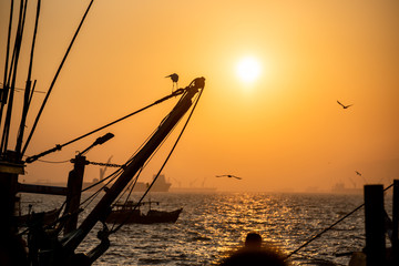 Wall Mural - fishing boat in the sunset