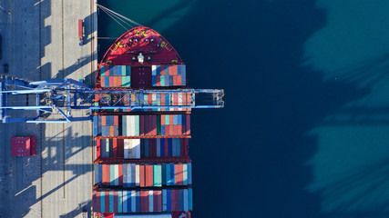 Aerial top down photo of industrial cargo container logistics terminal