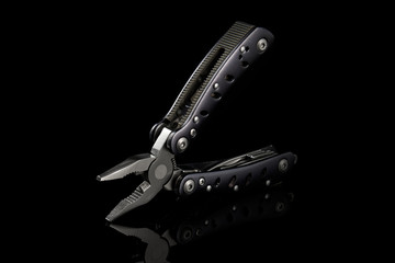 Hand Tool Multi Tool on a Black Background