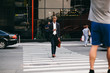 © Svyatoslav Lypynskyy - Attractive Businessman With A Mobile Phone Is Rushing To Work While Crossing The Road