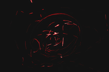 Red laser ray on black background.